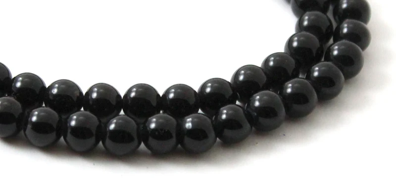 Hebras de cuentas negras redondas de obsidiana
